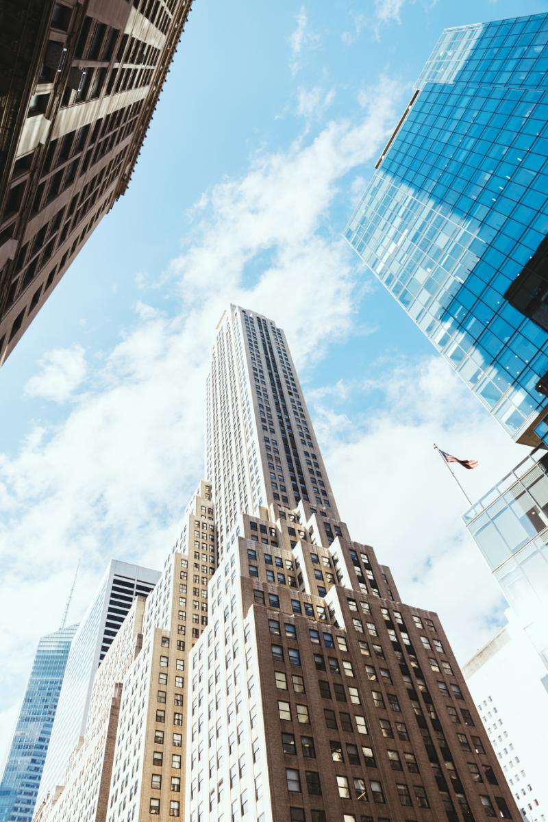 Low-angle view of urban high-rise real estate buildings.
